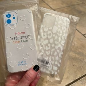 Two (2) brand new iPhone cases -12/22 pro. Clear - smile & leopard